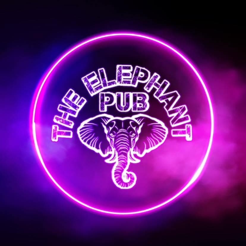 L’enseigne au néon du pub : la tête d’éléphant dans son cercle rose